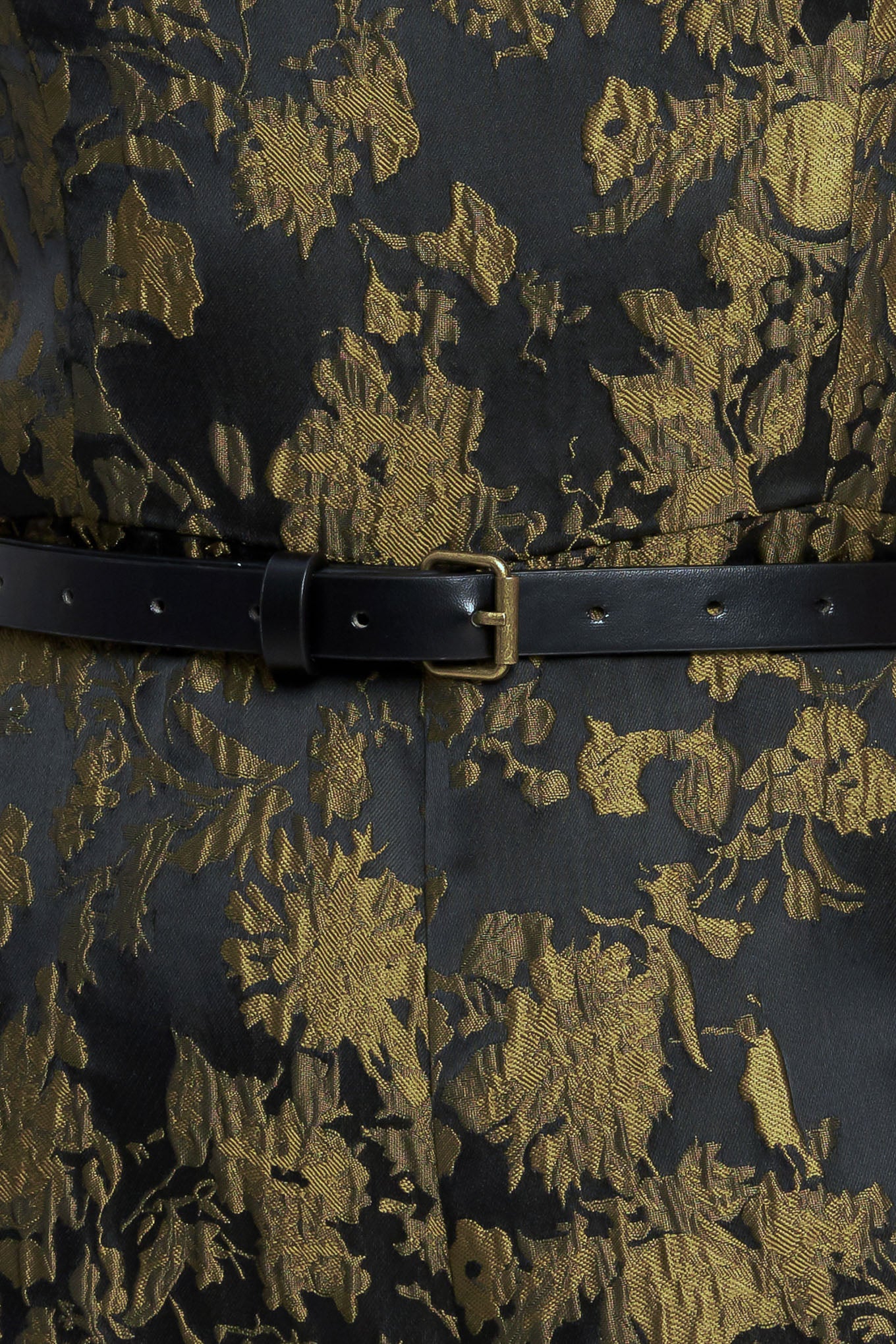 A jacquard woven jumpsuit featuring strapless neckline, contrasting belt, wide leg and back zipper closure