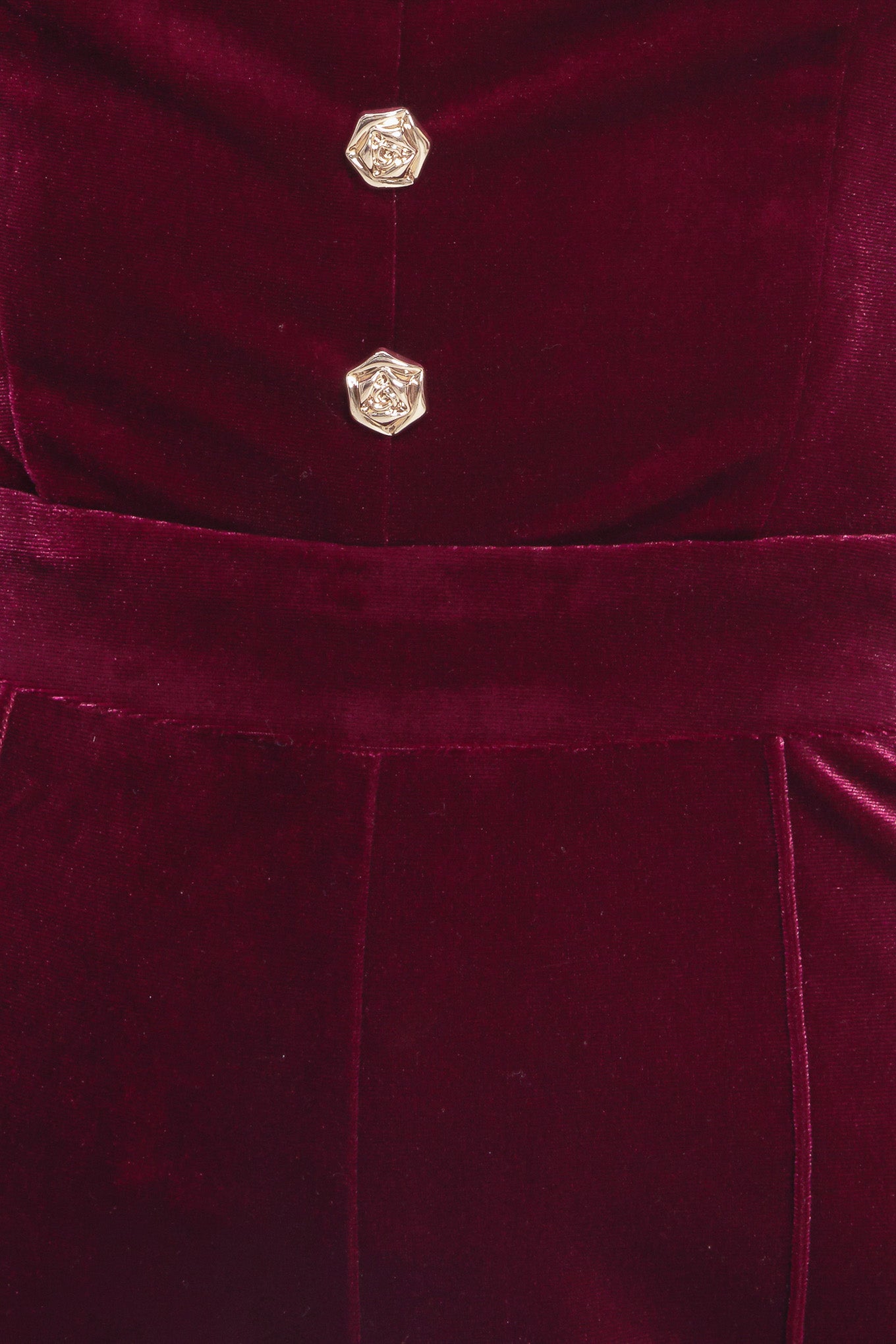 A velvet jumpsuit featuring strapless sweetheart neckline, front button detail, wide leg and back zipper closure