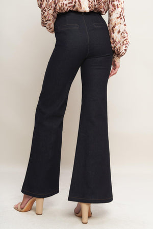 A denim pant featuring front closure, side pockets, self belt and flare leg