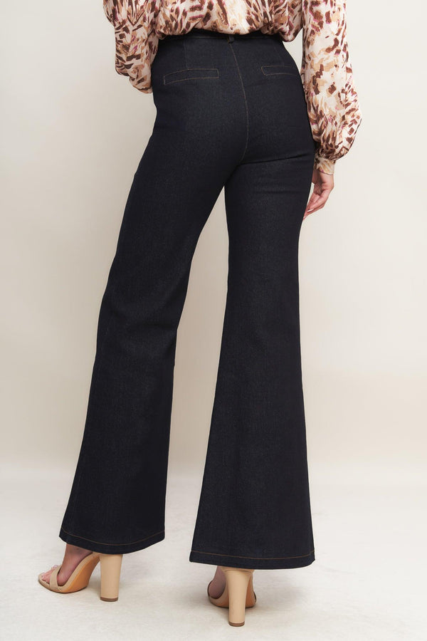 A denim pant featuring front closure, side pockets, self belt and flare leg
