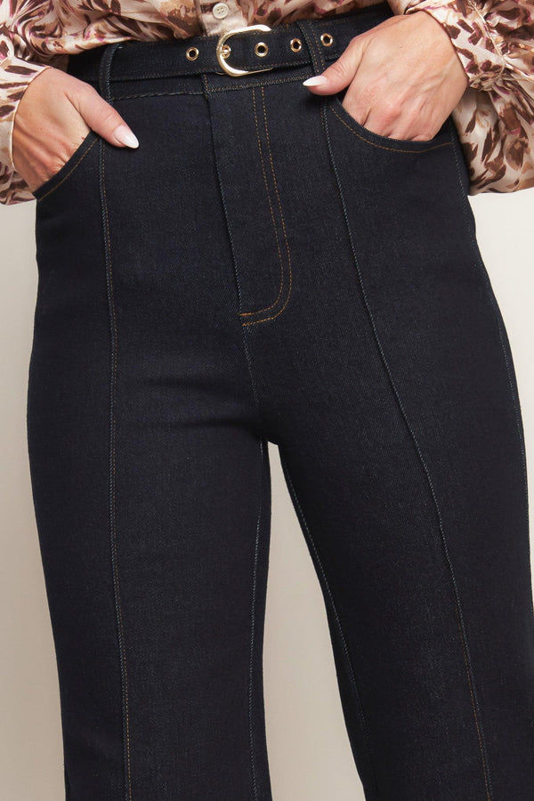 A denim pant featuring front closure, side pockets, self belt and flare leg