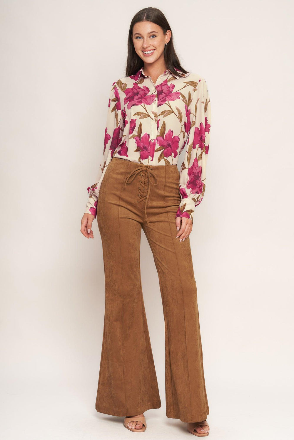 A faux suede pant featuring front lace up detail, flare leg and back zipper closure