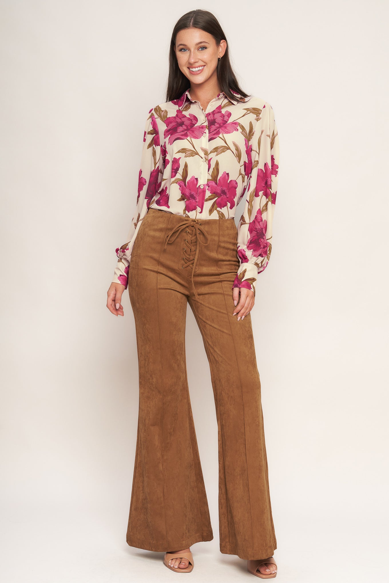 A faux suede pant featuring front lace up detail, flare leg and back zipper closure