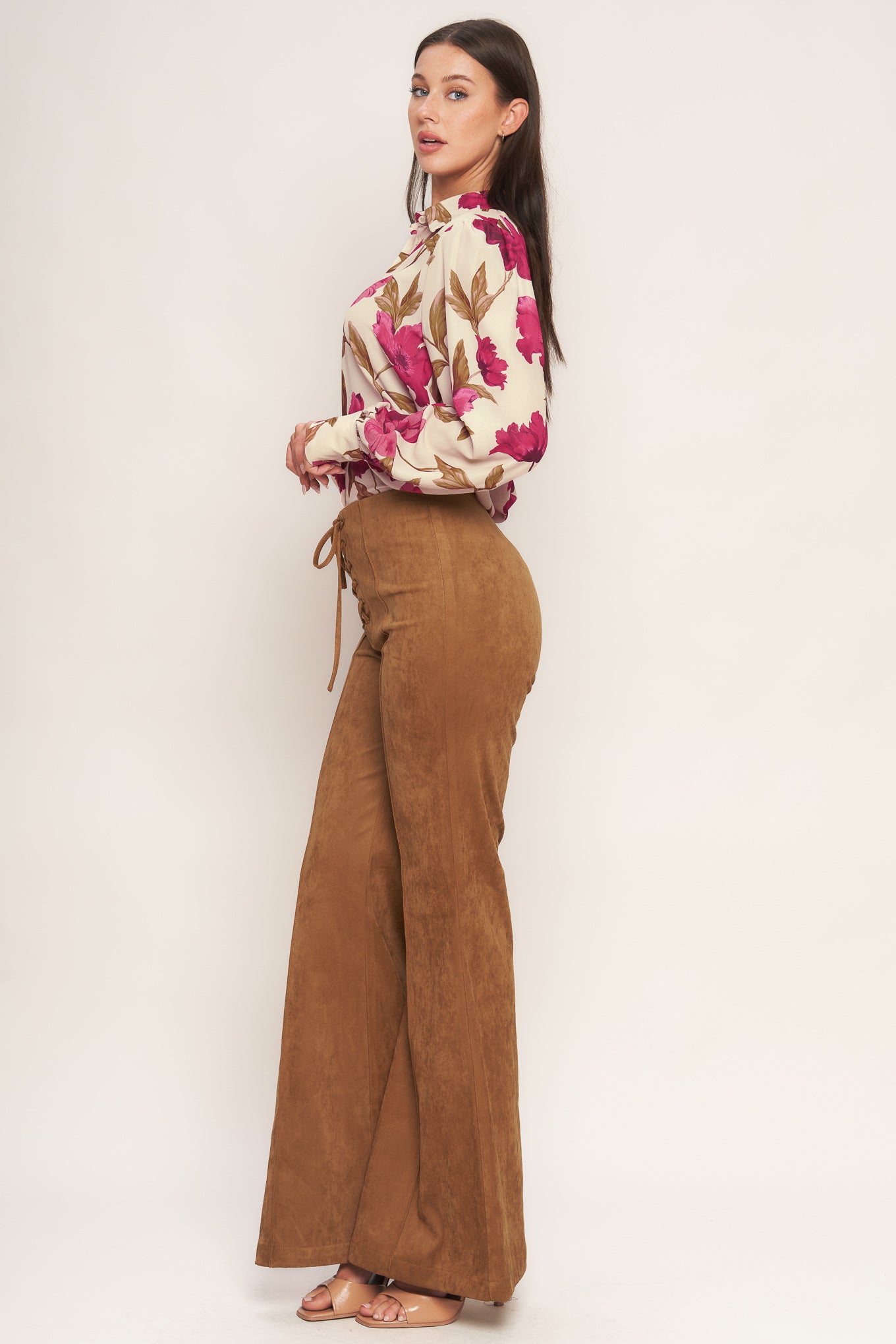 A faux suede pant featuring front lace up detail, flare leg and back zipper closure