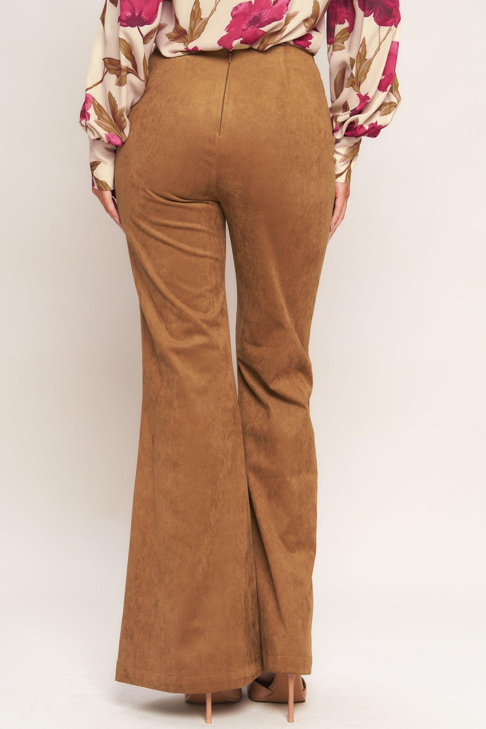 A faux suede pant featuring front lace up detail, flare leg and back zipper closure