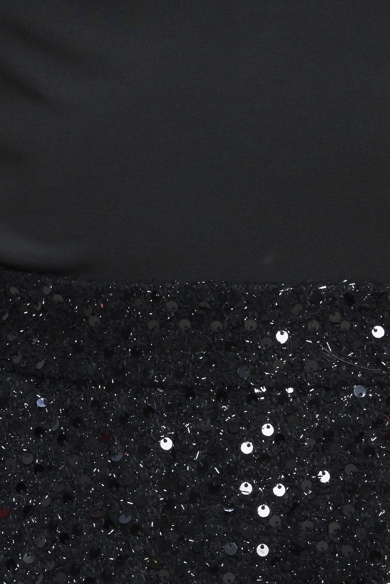 A knit top and sequin short romper featuring round neckline, sleeveless, sequin short, side tab with button detail, pockets and back zipper closure