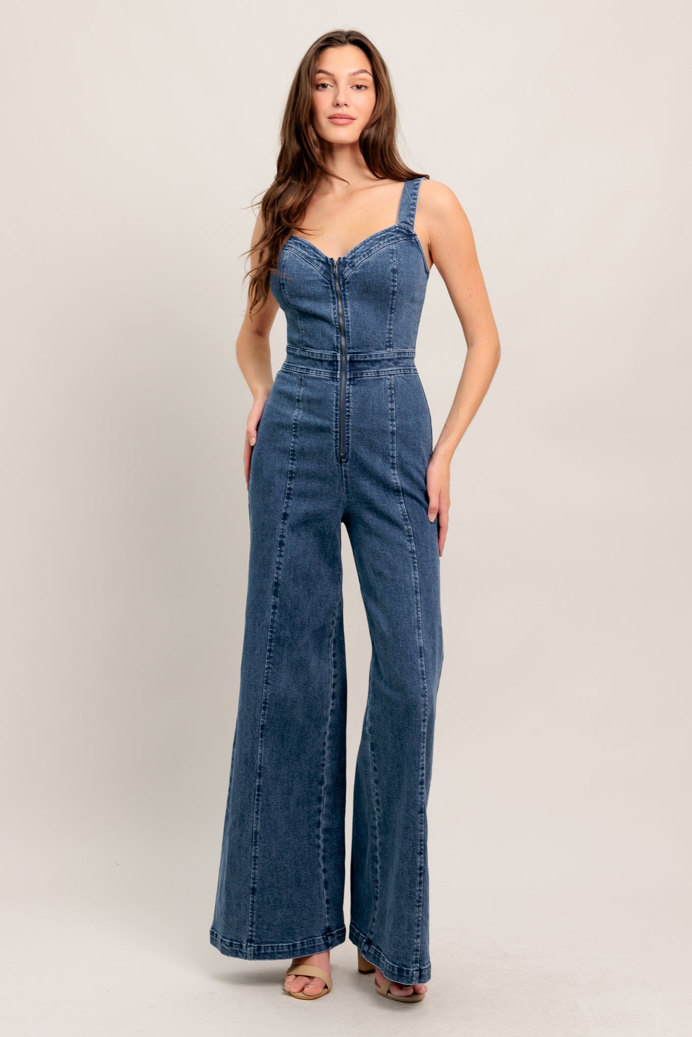 
A washed denim jumpsuit featuring V neckline, straps and front zipper closure

Details:

Self : 99% Cotton 1% Spandex

Size &amp; Fit

- Model is 5`8" And Wearing Size Small
- Measurements Taken From Size Small
- Approx. Length: 60" FLYING TOMATO