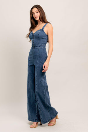 
A washed denim jumpsuit featuring V neckline, straps and front zipper closure

Details:

Self : 99% Cotton 1% Spandex

Size &amp; Fit

- Model is 5`8" And Wearing Size Small
- Measurements Taken From Size Small
- Approx. Length: 60" FLYING TOMATO