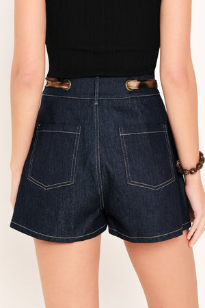Woman wearing a denim skort with a leopard print ribbon waist tie | Flying Tomato