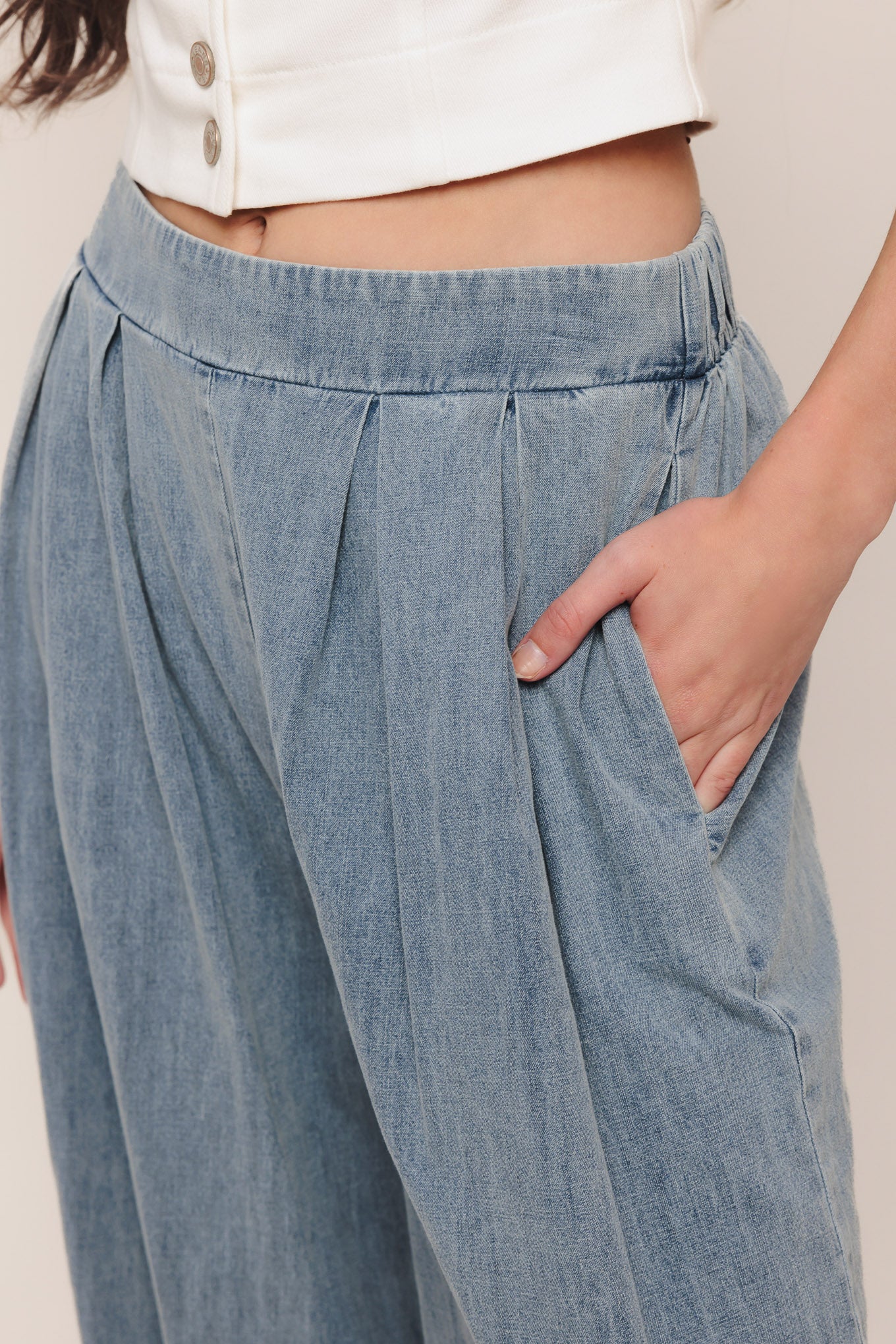 A lightweight washed denim pant with front pleats, wide leg and elasticized back waistband. Matching top IT14026B

Details:

Self: 100% Cotton

Contrast: 100% Cotton

Size & Fit

-Model is 5`8" And Wearing Size Small
-Measurements Taken From Size Small
-Approx. Length: 43"
