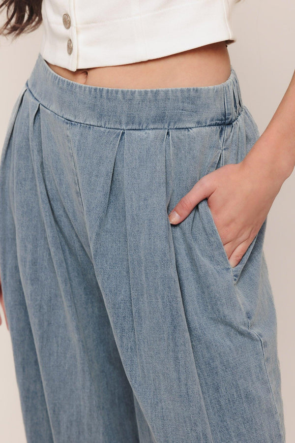 A lightweight washed denim pant with front pleats, wide leg and elasticized back waistband. Matching top IT14026B

Details:

Self: 100% Cotton

Contrast: 100% Cotton

Size & Fit

-Model is 5`8" And Wearing Size Small
-Measurements Taken From Size Small
-Approx. Length: 43"
