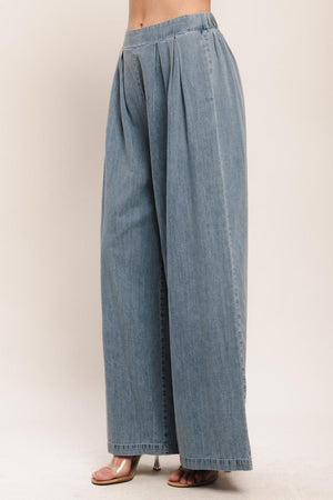 A lightweight washed denim pant with front pleats, wide leg and elasticized back waistband. Matching top IT14026B

Details:

Self: 100% Cotton

Contrast: 100% Cotton

Size & Fit

-Model is 5`8" And Wearing Size Small
-Measurements Taken From Size Small
-Approx. Length: 43"