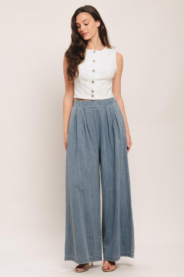 A lightweight washed denim pant with front pleats, wide leg and elasticized back waistband. Matching top IT14026B

Details:

Self: 100% Cotton

Contrast: 100% Cotton

Size & Fit

-Model is 5`8" And Wearing Size Small
-Measurements Taken From Size Small
-Approx. Length: 43"