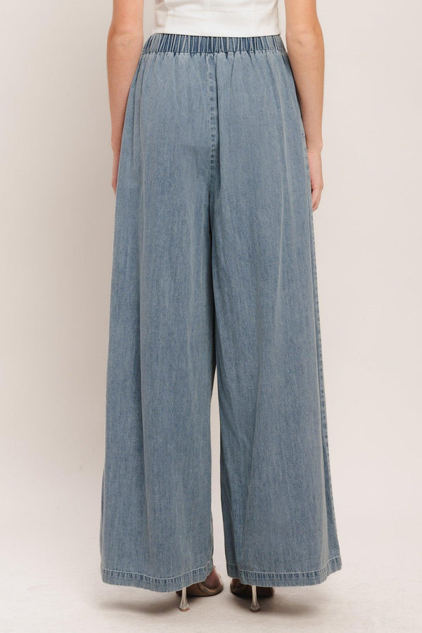 A lightweight washed denim pant with front pleats, wide leg and elasticized back waistband. Matching top IT14026B

Details:

Self: 100% Cotton

Contrast: 100% Cotton

Size & Fit

-Model is 5`8" And Wearing Size Small
-Measurements Taken From Size Small
-Approx. Length: 43"