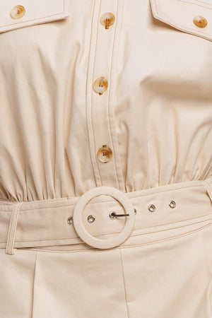 A solid woven romper featuring collar, short sleeve, button down, self belt, side and front pockets, and elastic back

Details:

Self: 97% Cotton 3% Spandex

Size & Fit

-Model is 5`8" And Wearing Size Small
-Measurements Taken From Size Small
-Approx. Length: 34"