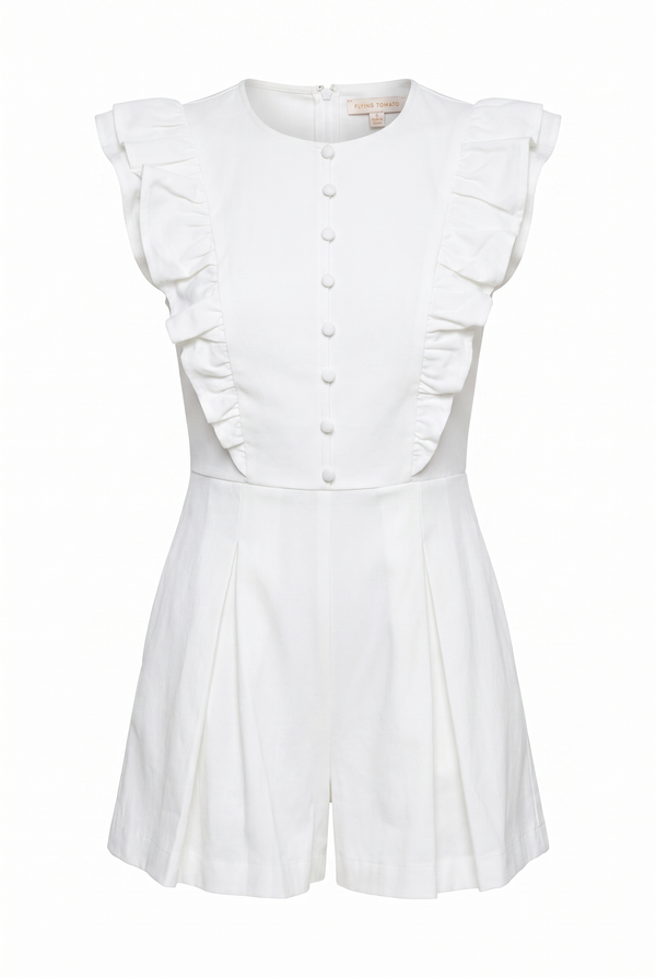 A white short-sleeve romper with ruffled cap sleeves, a button-front bodice, and a flared skirt, shown on a plain white background.