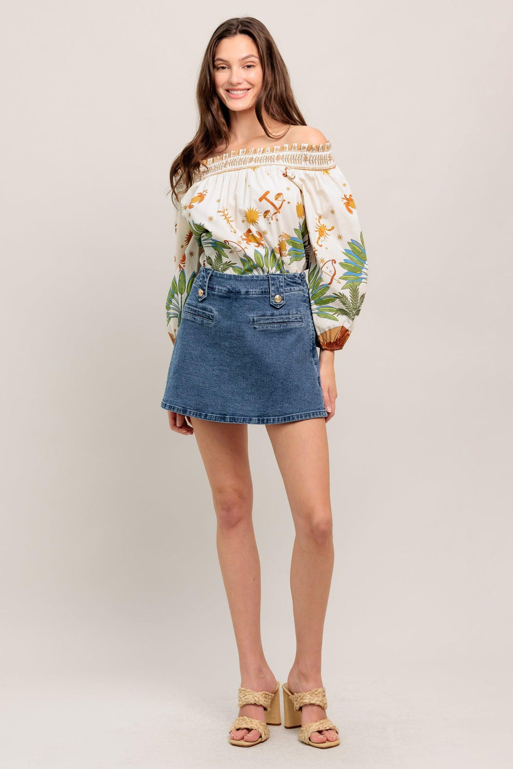 High-waisted washed denim mini skirt with a clean A-line shape and gold button details

Details:

Self: 99% Cotton 1% Spandex

Size & Fit

- Model is 5`8" And Wearing Size Small
- Measurements Taken From Size Small
- Approx. Length: 16"