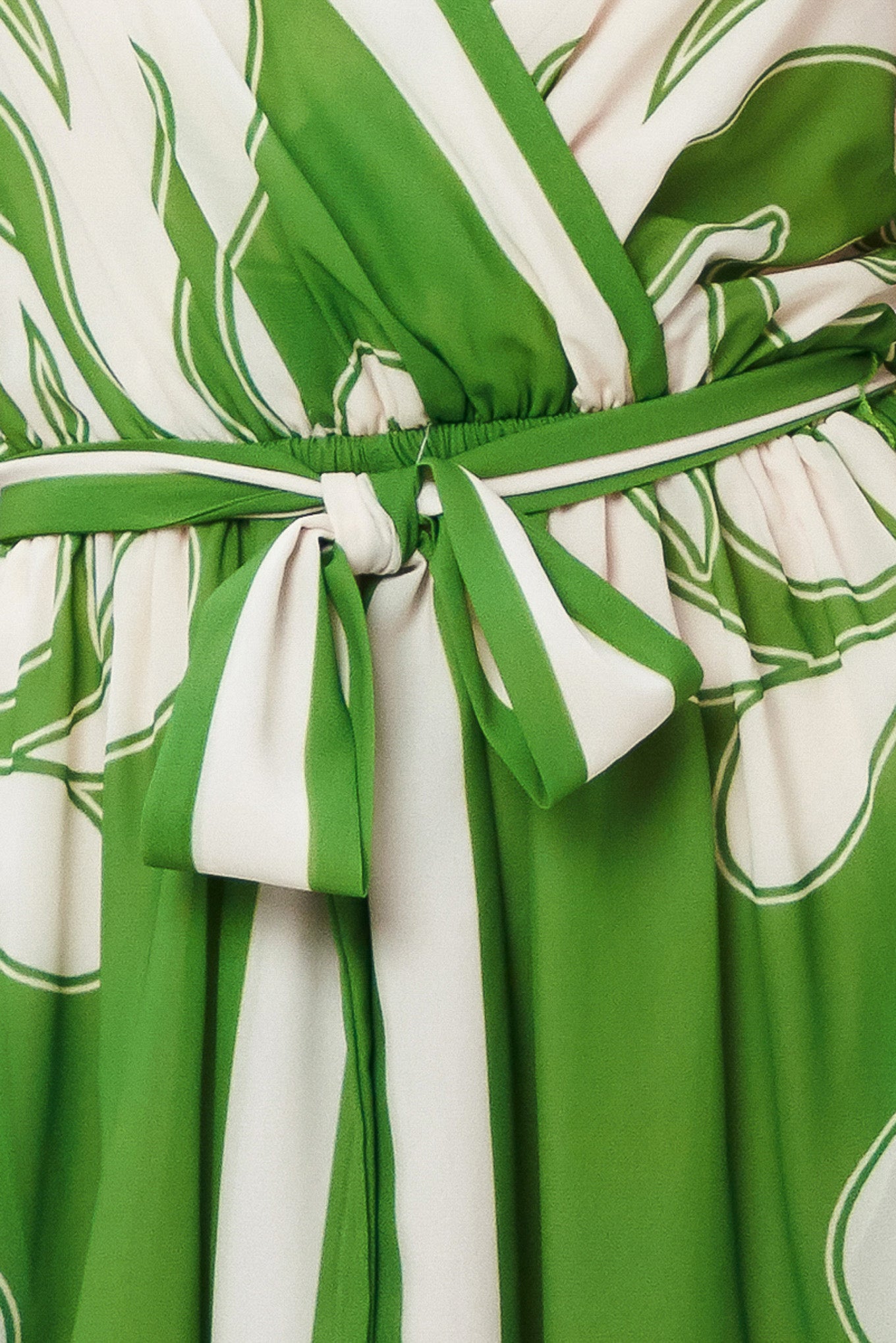 Green and white patterned fabric with a tie-front belt