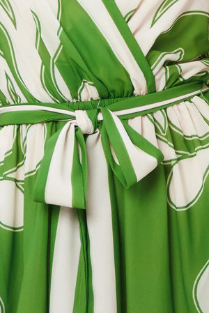 Green and white patterned fabric with a tie-front belt