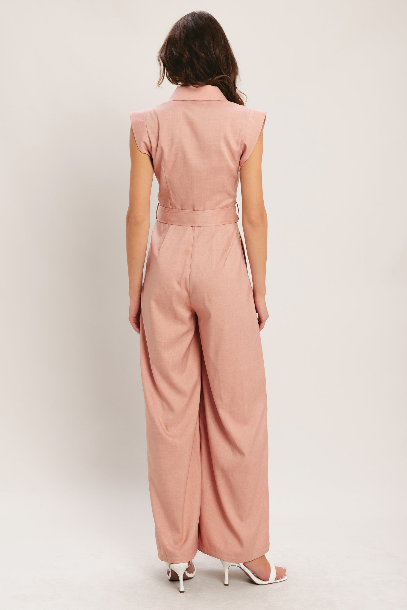 
A solid woven jumpsuit featuring collar, short sleeve, front button zipper closure, self belt, side pocket and wide leg

Details:

Self : 95% Polyester 5% Spandex

Size &amp; Fit

- Model is 5`8" And Wearing Size Small
- Measurements Taken From Size Small
- Approx. Length: 60"