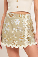 Woman wearing a skort with decorative pattern and scalloped edge skort | Flying Tomato