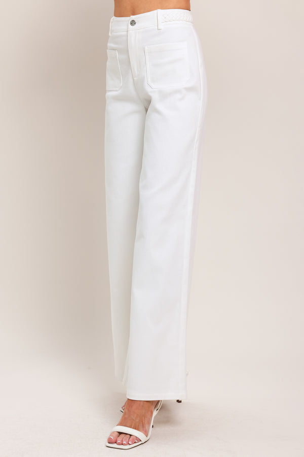 Woman wearing white wide-leg pants with front closure and braided detail waistband | Flying Tomato