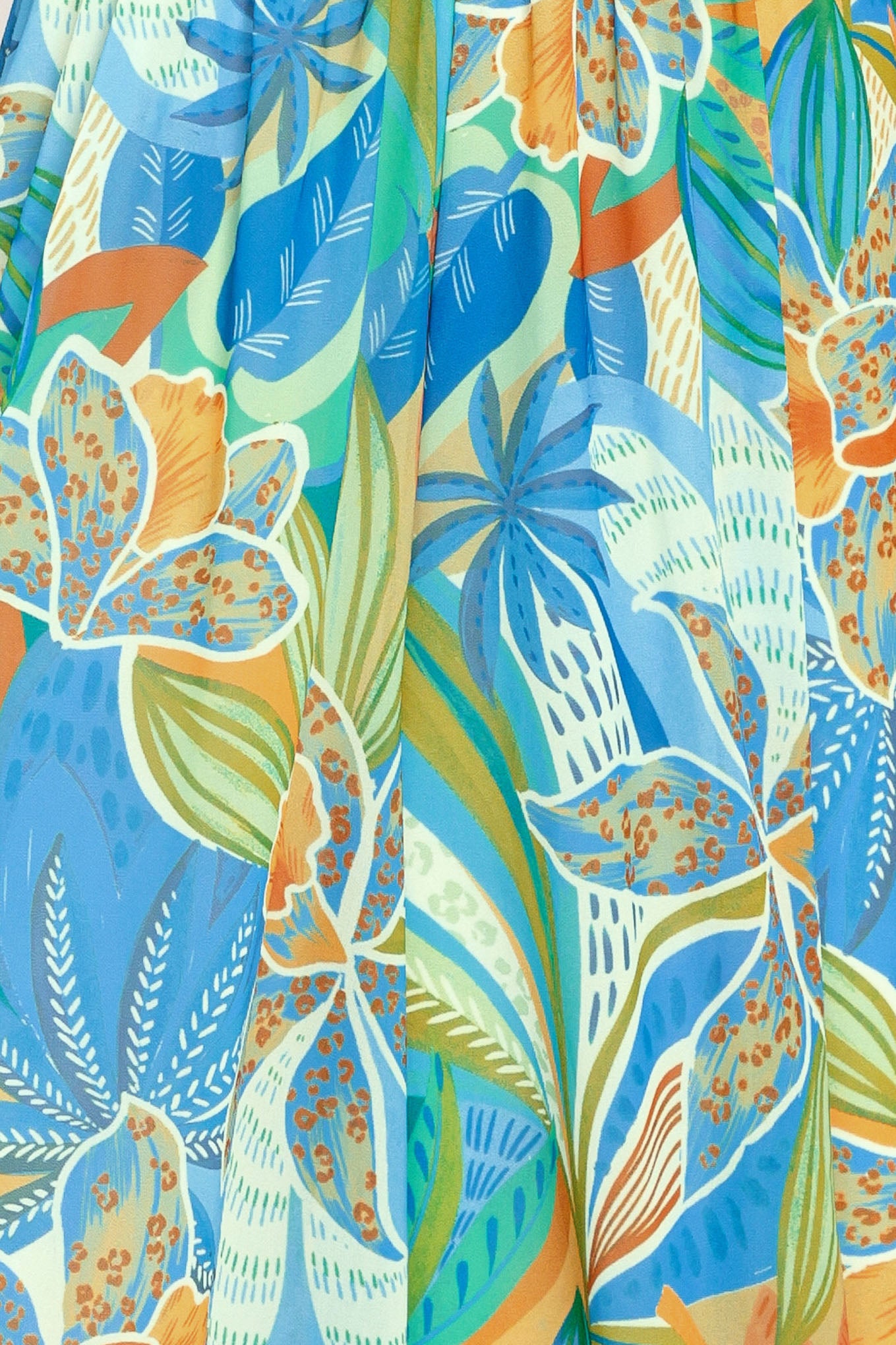 Close up of a blue multicolored patterned woven jumpsuit featuring V neckline, shoulder ties, smocked waistband and wide leg | Flying Tomato