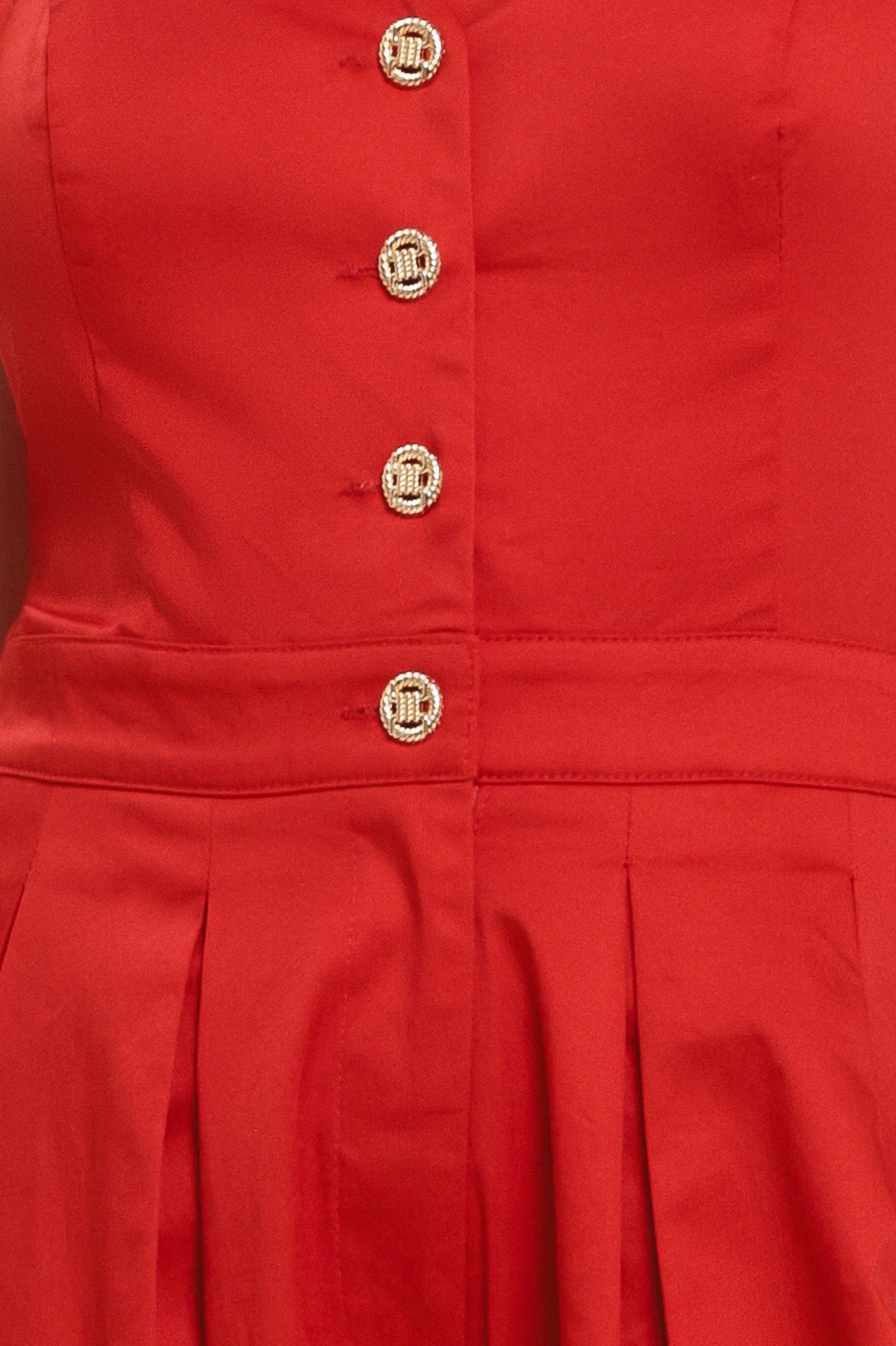 Woman wearing a red wide leg jumpsuit with buttons | Flying Tomato