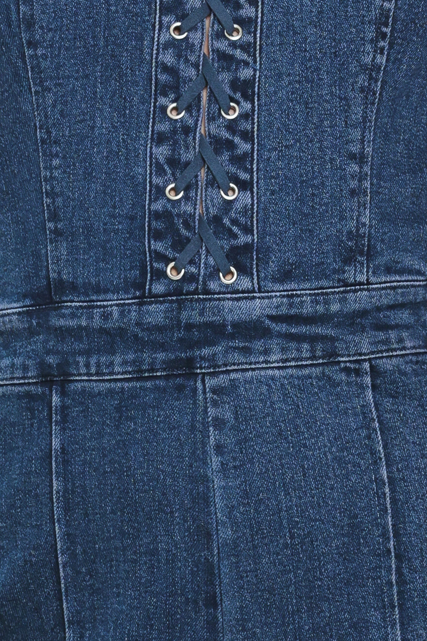Close-up of a blue denim jumpsuit with lace-up front | Flying Tomato