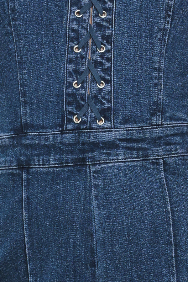 Close-up of a blue denim jumpsuit with lace-up front | Flying Tomato