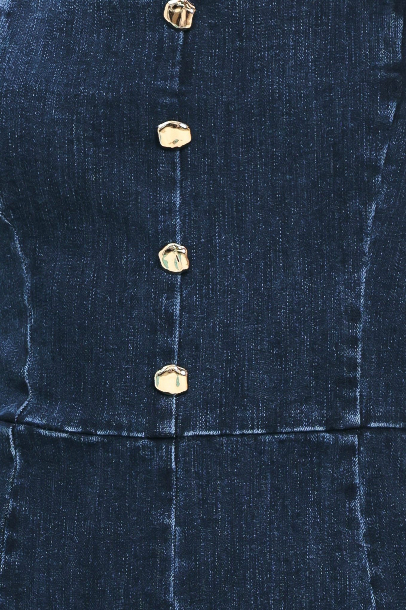 Close up of a denim romper featuring with button detail | Flying Tomato