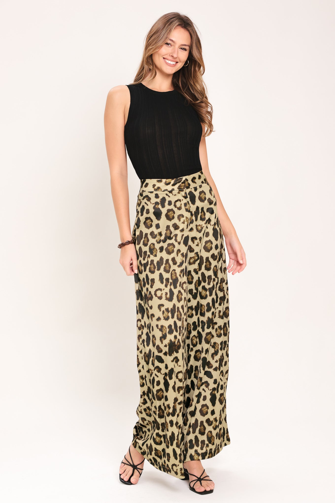 Woman wearing leopard print wide leg pant with front closure | Flying Tomato