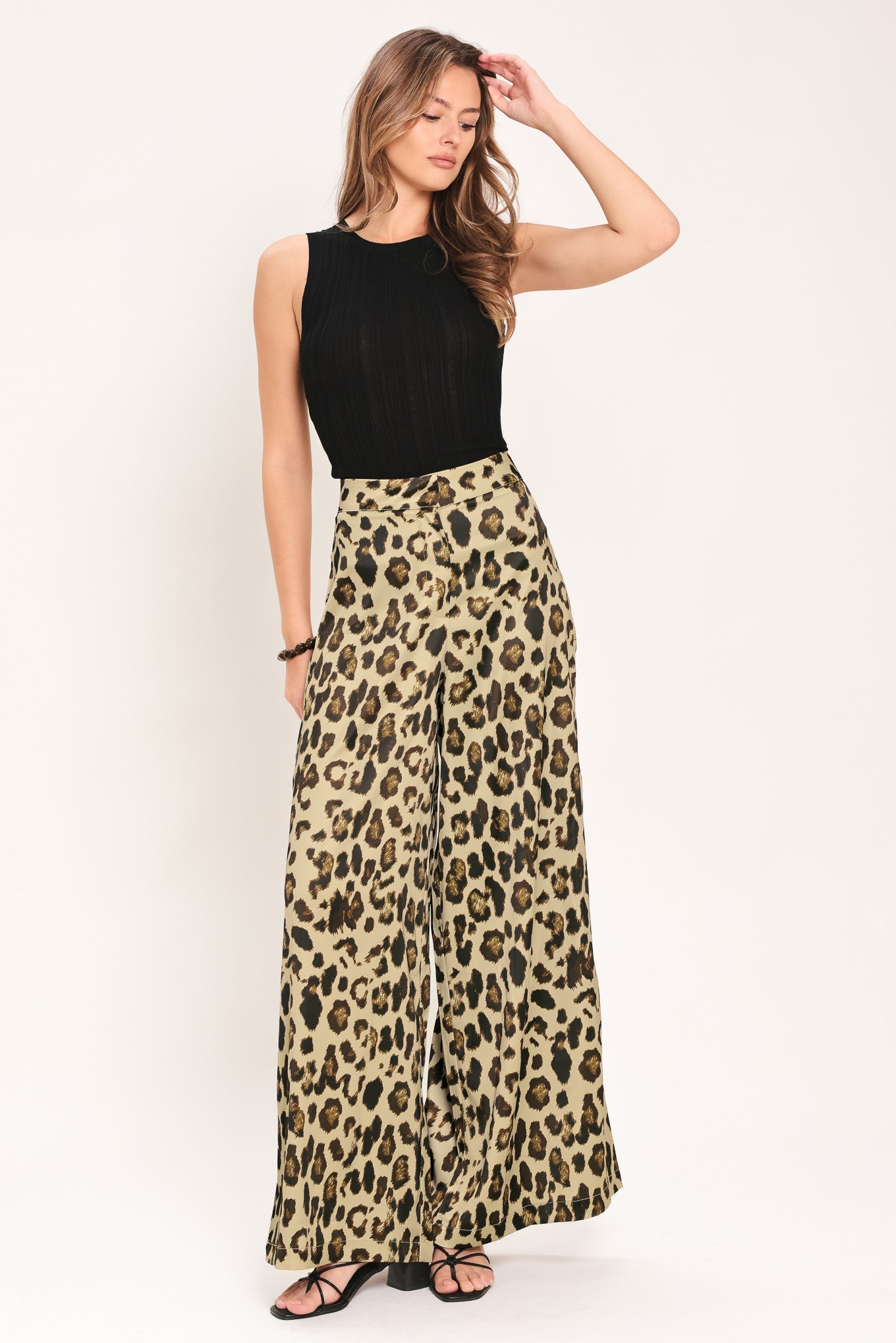Woman wearing leopard print wide leg pant with front closure | Flying Tomato