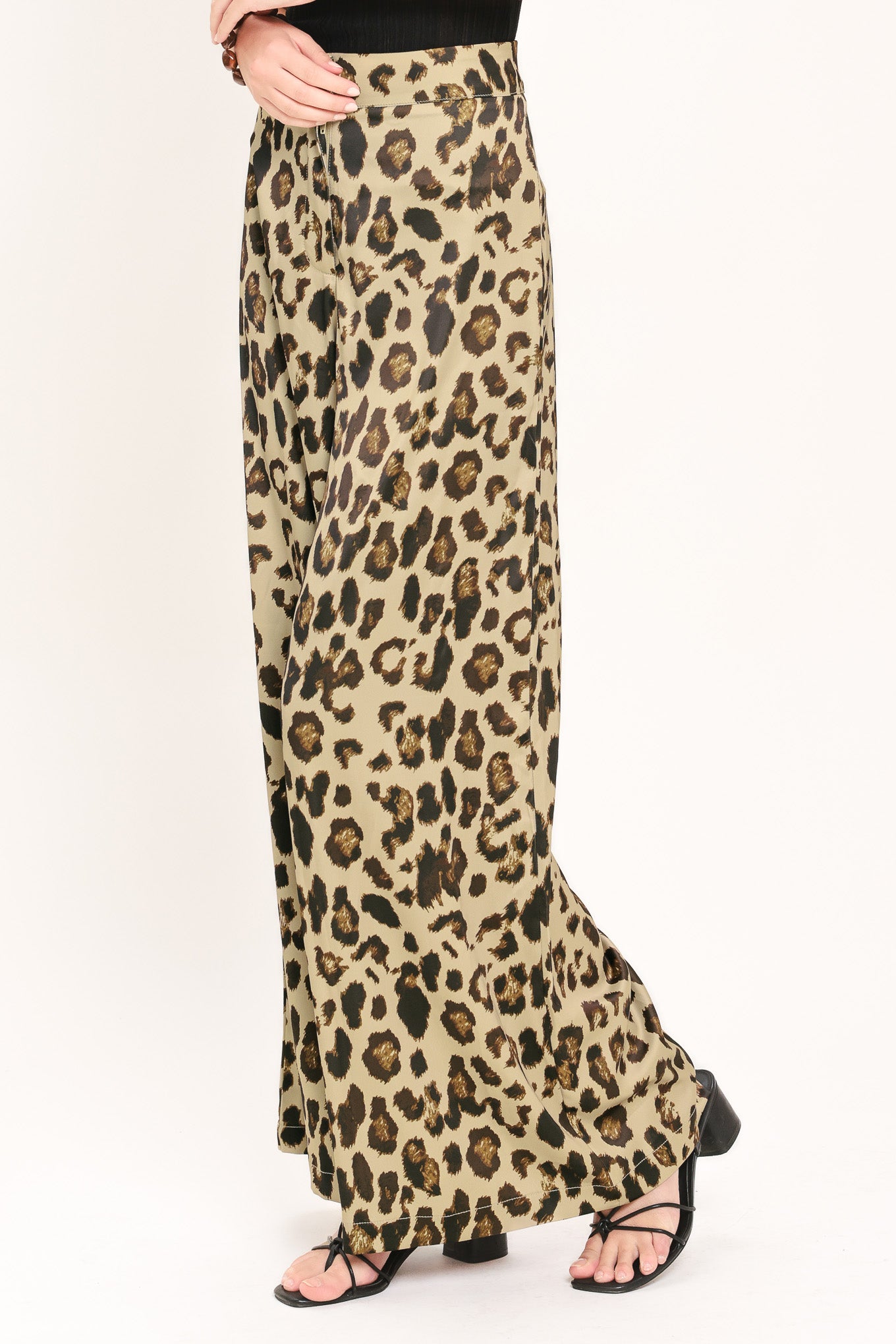Woman wearing leopard print wide leg pant with front closure | Flying Tomato