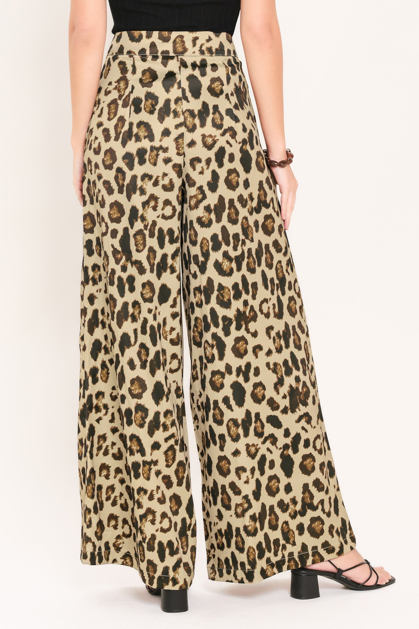 Woman wearing leopard print wide leg pant with front closure | Flying Tomato