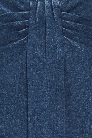 A woman wearing a dark blue denim mini skort | Flying Tomato