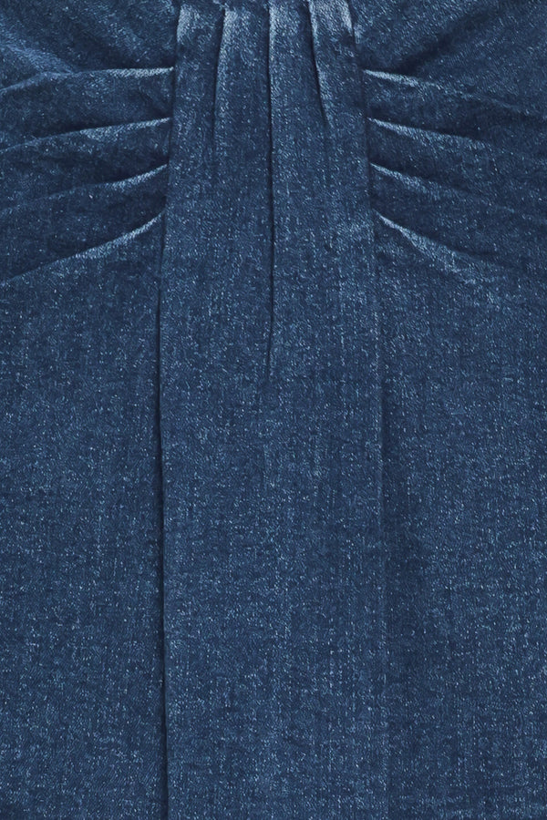 A woman wearing a dark blue denim mini skort | Flying Tomato