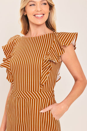 A woman wearing a mini skort romper with vertical rust and white stripes | Flying Tomato