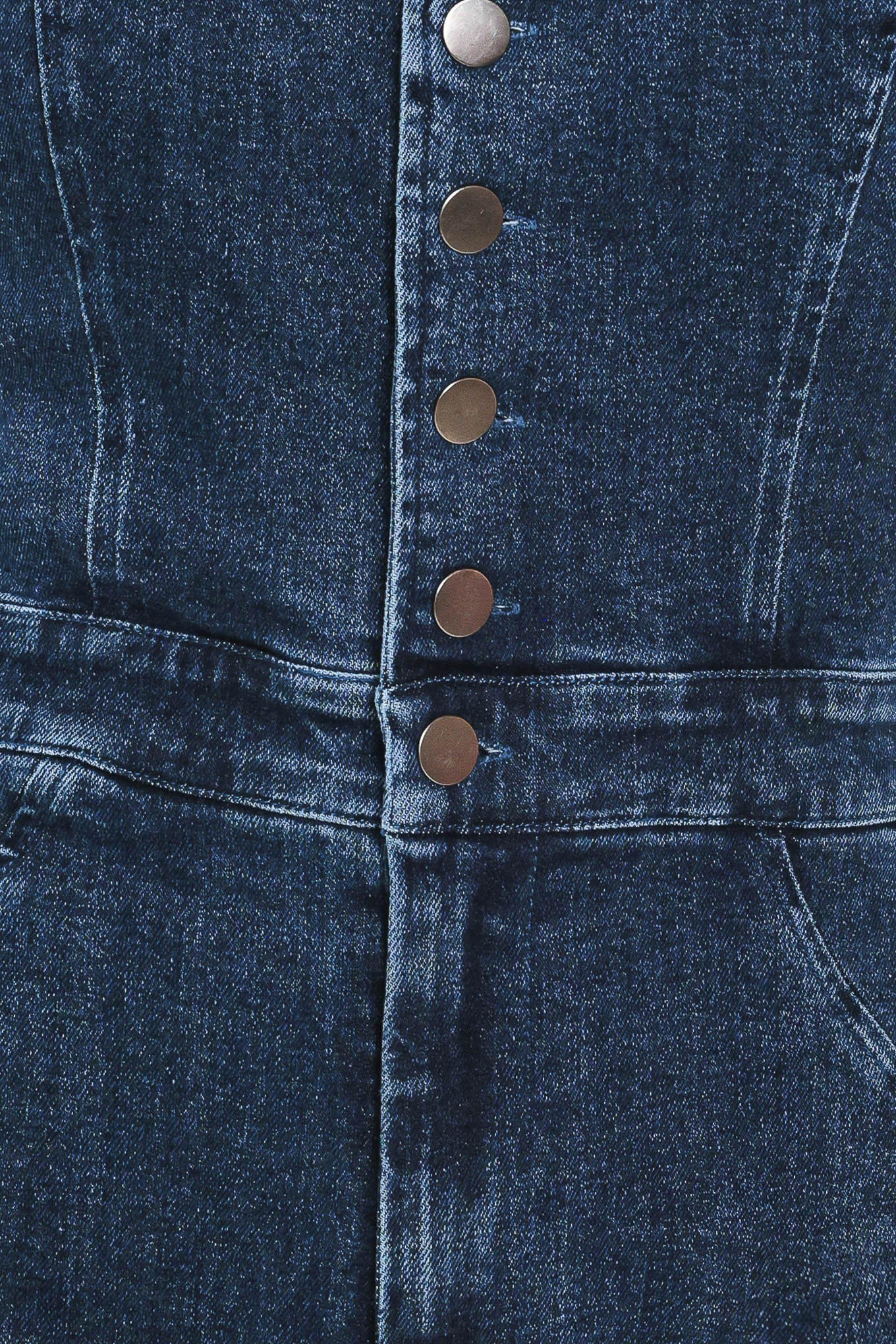 A woman wearing a dark blue denim halter jumpsuit with a button-front bodice and wide flared legs | Flying Tomato 