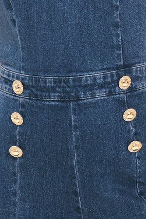 Woman wearing a denim jumpsuit featuring halter neckline, front button detail, wide leg, bare back and zipper closure | Flying Tomato