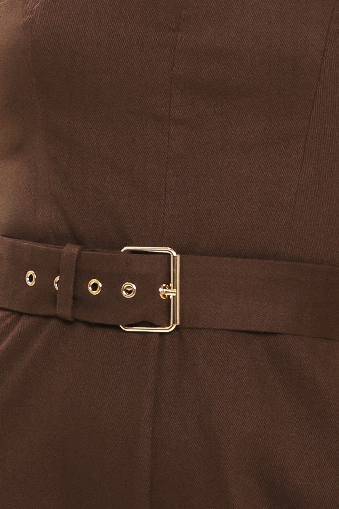 Woman wearing a brown solid woven jumpsuit featuring sweetheart neckline, straps, self belt, wide leg and back zipper closure | Flying Tomato