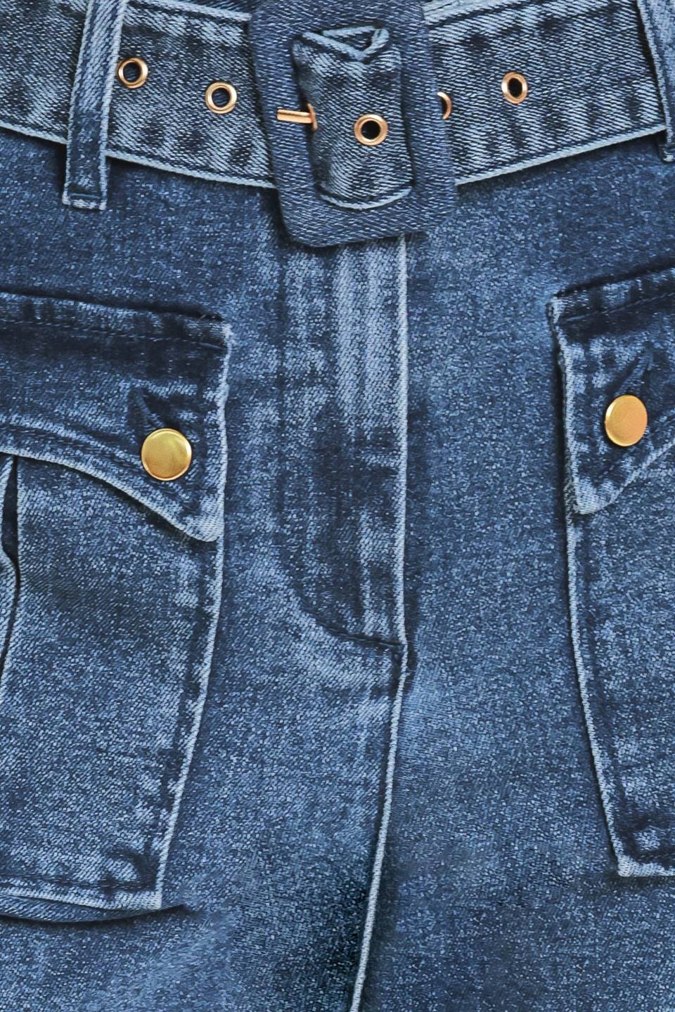 A woman wearing blue high-waisted flare jeans with front flap pockets and gold-tone button details | Flying Tomato