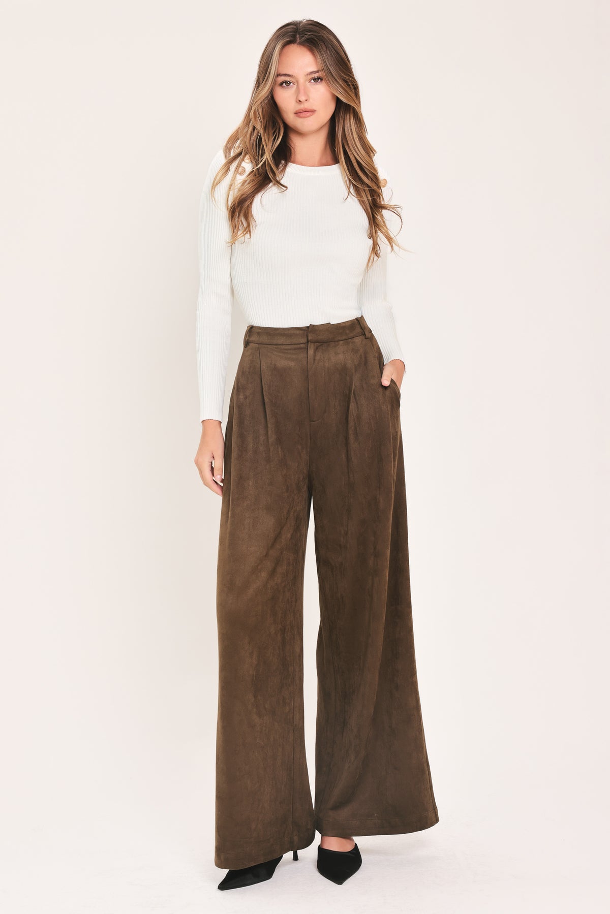 A person wearing high-waisted, wide-leg brown suede pants | Flying Tomato