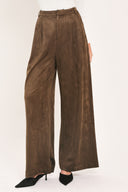 A person wearing high-waisted, wide-leg brown suede pants | Flying Tomato