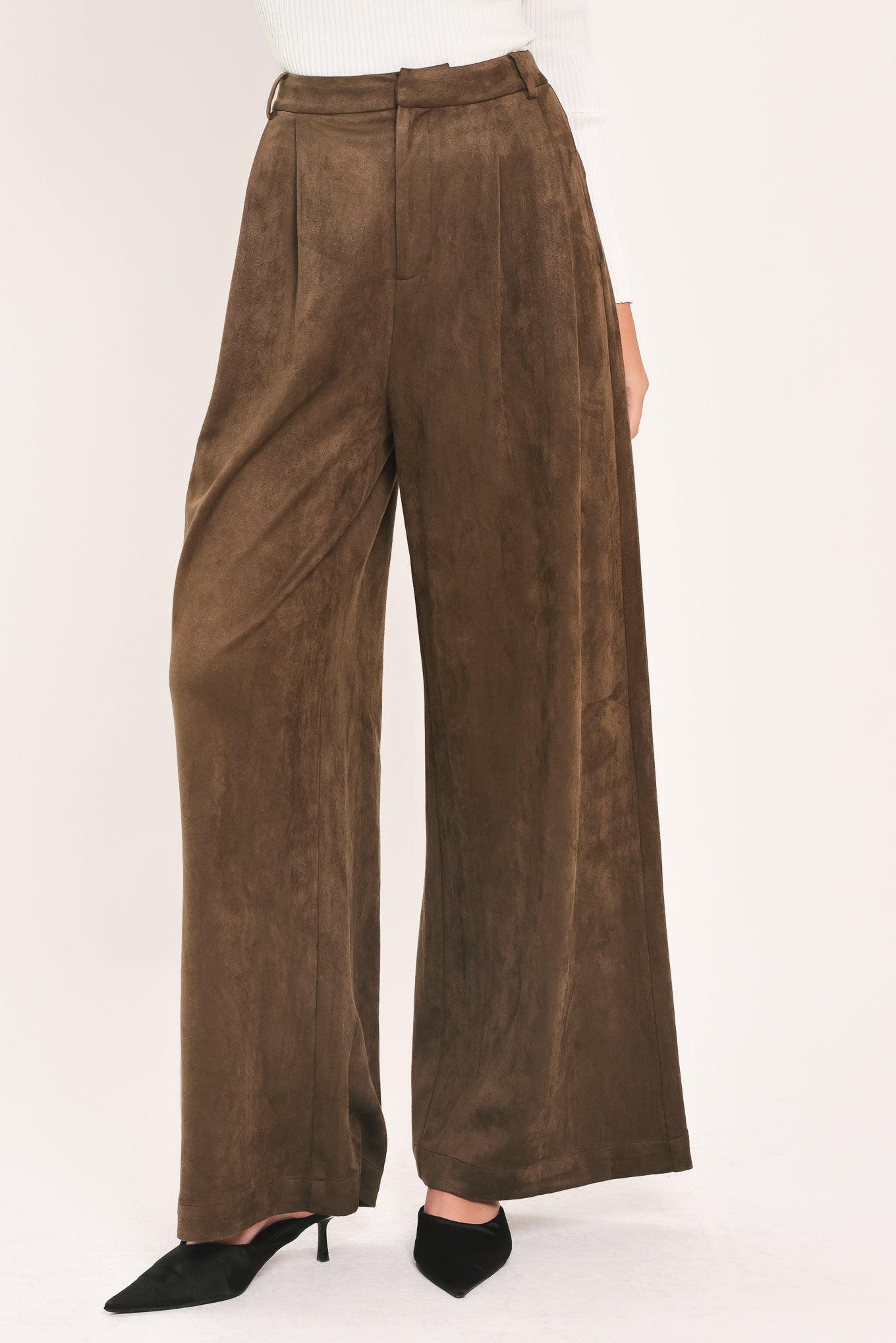 A person wearing high-waisted, wide-leg brown suede pants | Flying Tomato