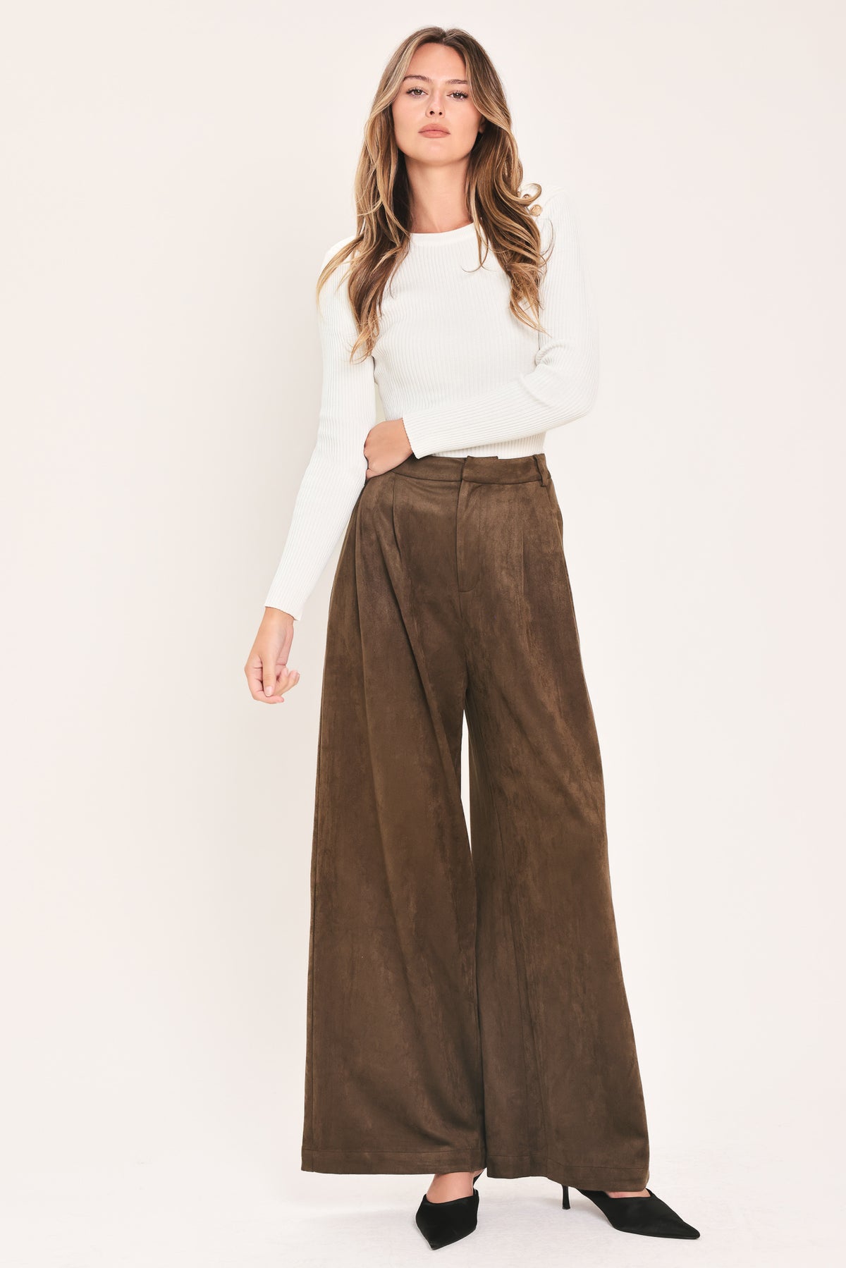 A person wearing high-waisted, wide-leg brown suede pants | Flying Tomato