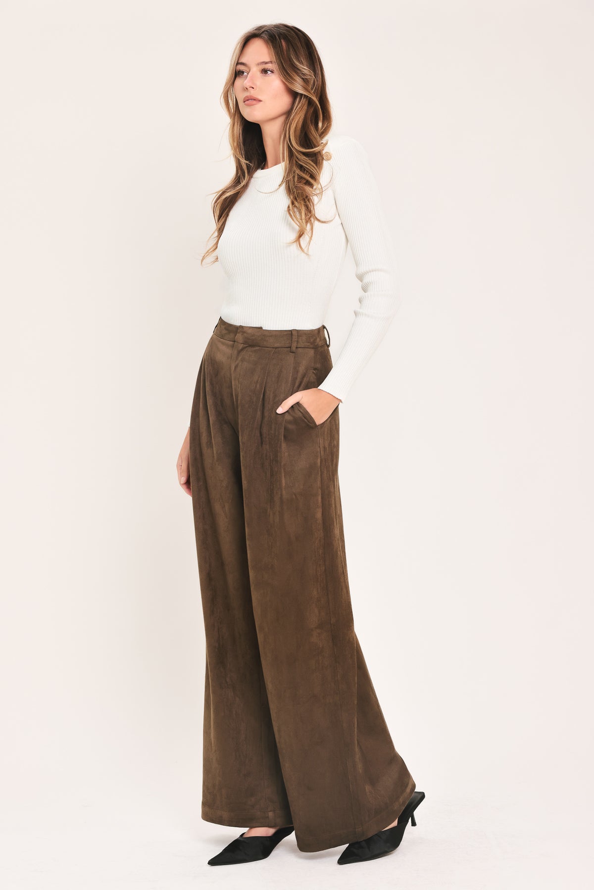 A person wearing high-waisted, wide-leg brown suede pants | Flying Tomato