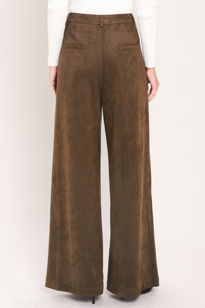 A person wearing high-waisted, wide-leg brown suede pants | Flying Tomato
