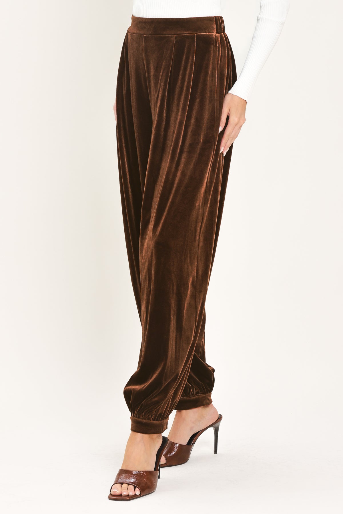 A person wearing high-waisted, loose brown velvet harem-style pants with gathered cuffs | Flying Tomato