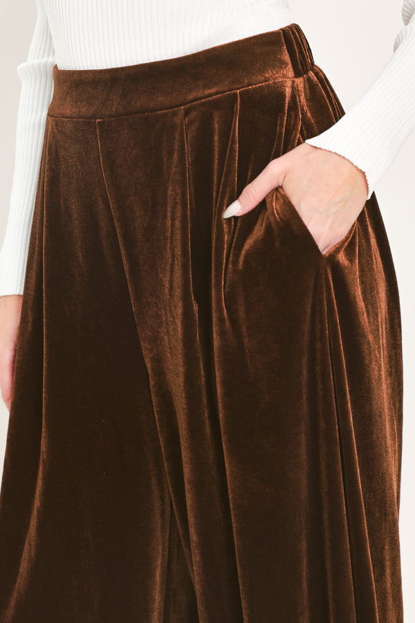 A person wearing high-waisted, loose brown velvet harem-style pants with gathered cuffs | Flying Tomato